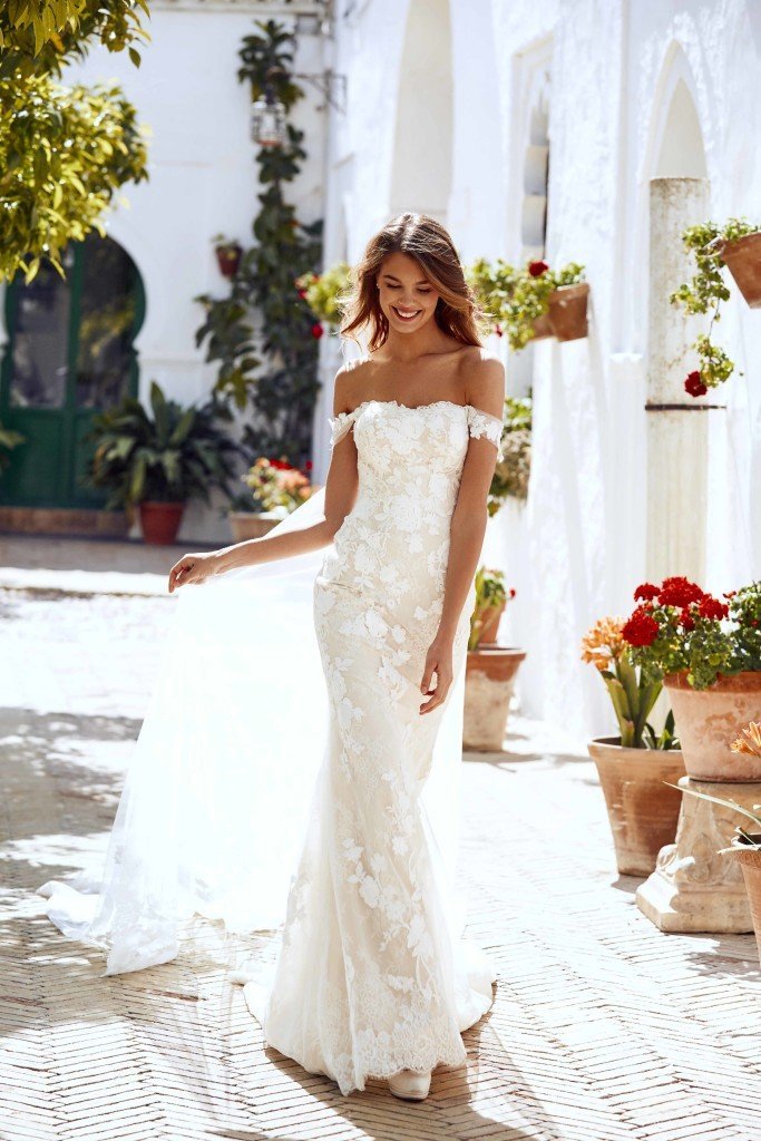 Woman walking in Pronovias lace wedding gown