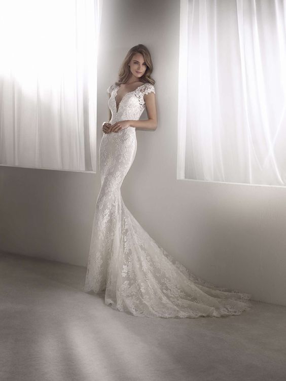Spanish lace mermaid wedding gown with cap sleeves Modes