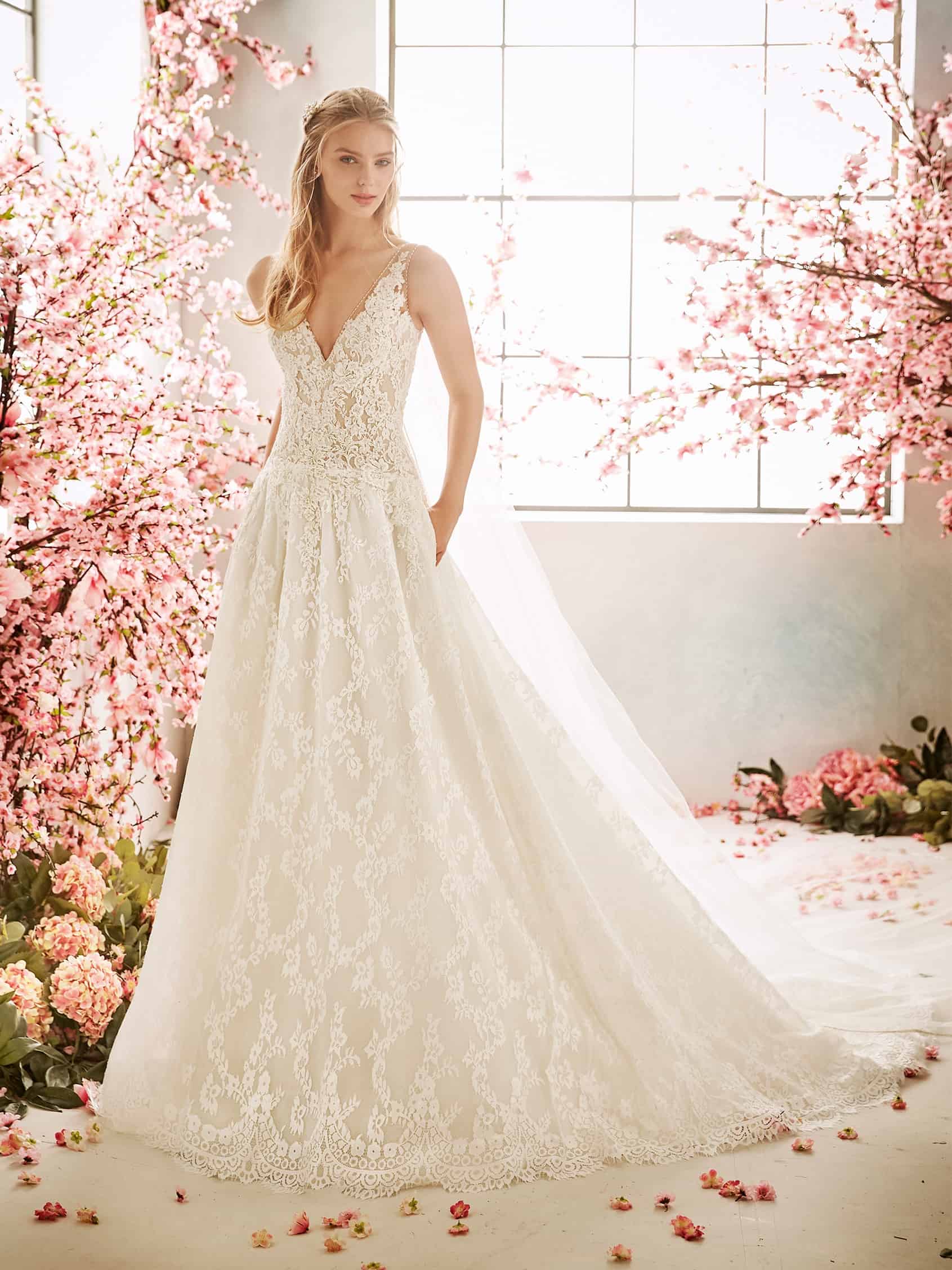 Stunning fully laced Aline wedding gown, deep V neck