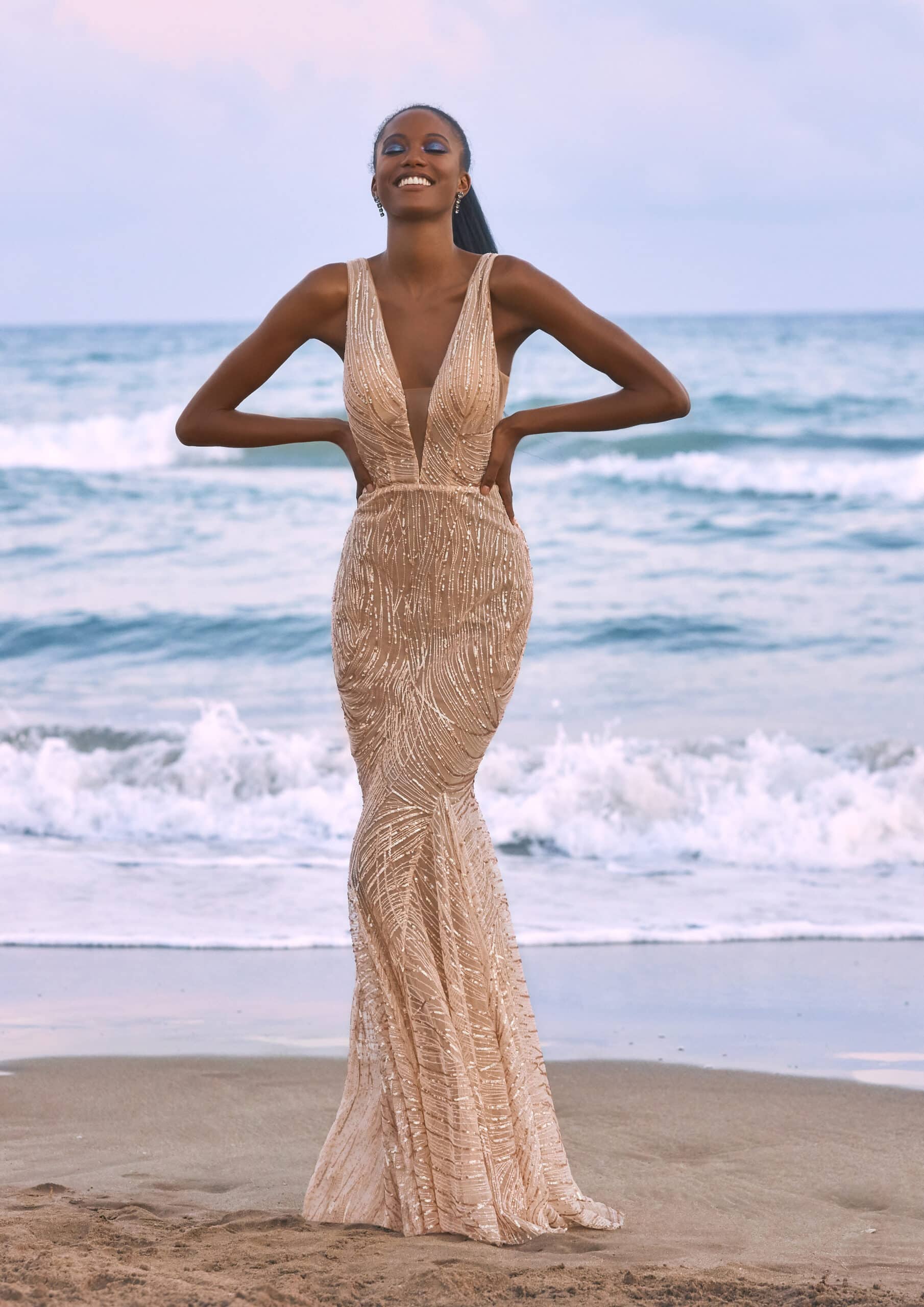 PLANGE NECK GOLD SEQUIN FITTED GOWN.JPG